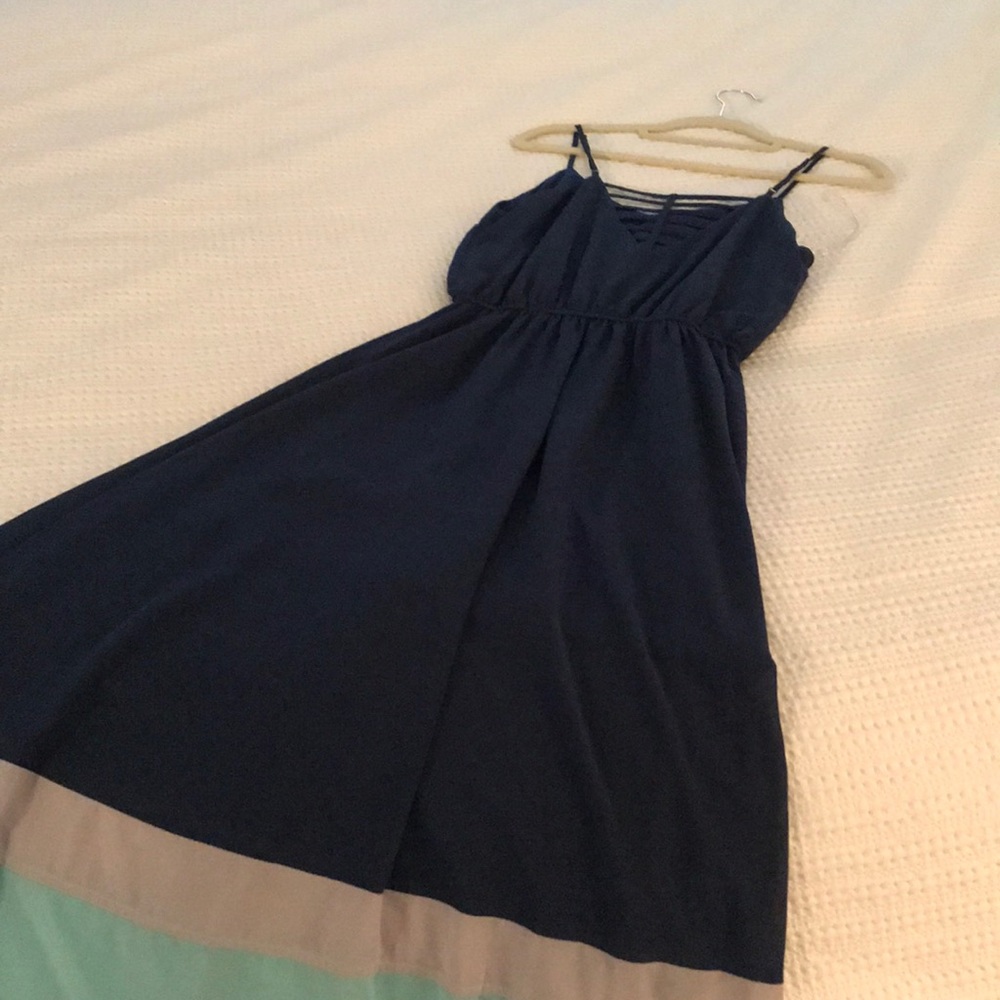 Blue maxi dress with sheer overlay.